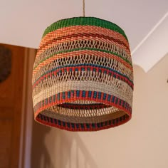 a multicolored light hanging from a ceiling