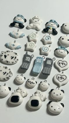 there are many different cell phones and pandas on the table together in this photo