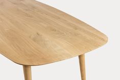 a wooden table with two legs and a curved top, viewed from the front view