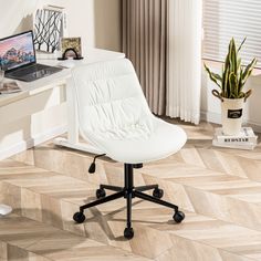 a white office chair sitting on top of a wooden floor next to a laptop computer