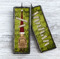 two bookmarks with an image of a person wearing a santa hat on top of them