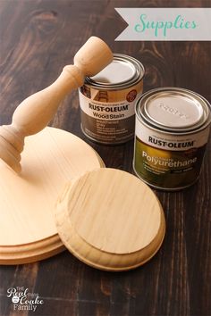 two wooden spatulas and some paint sitting on top of a table with text overlay