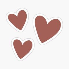 three brown hearts stickers on a white background