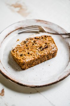 a piece of food on a plate with a fork