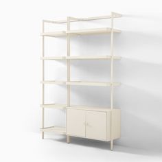 a white bookcase with two doors and shelves on each side, in front of a wall