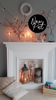 a fireplace mantel with candles, flowers and other items on it in front of a sign that reads new post