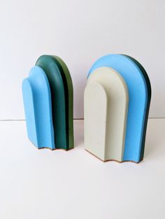 two blue and white toothbrush holders sitting next to each other