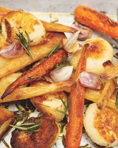 roasted potatoes and carrots with herbs on a plate