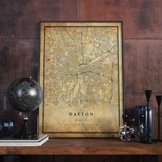 a framed map is sitting on a table