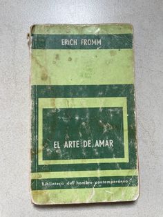 an old spanish book sitting on top of a table