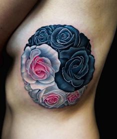 a woman's breast with roses painted on it and the bottom part of her stomach