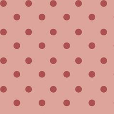 a pink background with red polka dots