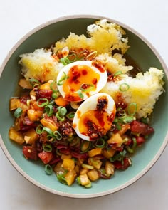 a bowl filled with food and topped with hard boiled eggs