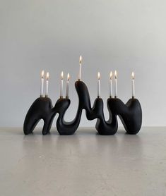 four candles are placed in the shape of elephants