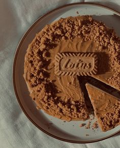 a chocolate cake on a plate with a piece cut out