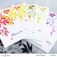 five cards with watercolor leaves on them