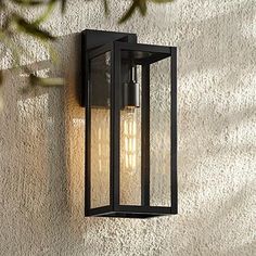 an outdoor light mounted on the side of a wall