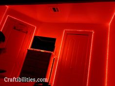 a room with red lights on the walls