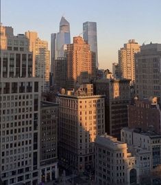 the city skyline is shown with tall buildings in the foreground and skyscrapers in the background