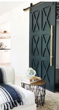 a living room filled with furniture and a sliding door