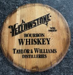 a wooden sign that says bourbon whiskey and taylor & williams distilleries on it