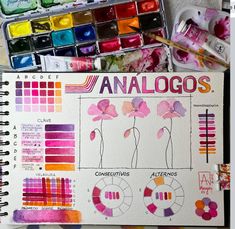 an artist's notebook with watercolors and markers