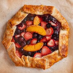 a pie with fruit toppings on top of it