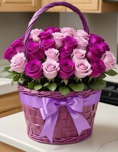 a purple basket filled with lots of pink roses