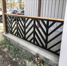 a black metal railing on the side of a building