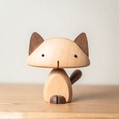 a wooden toy sitting on top of a table