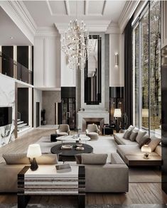 a large living room with couches, tables and chandelier hanging from the ceiling