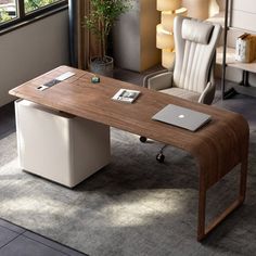 an office desk with a laptop on it and a chair next to it in front of a window