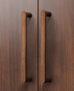 two wooden doors with handles on them