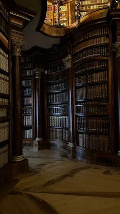 an old library with many bookshelves and chandelier in the ceiling,