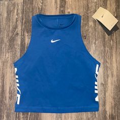 Sporty Nike Dri Fit Crop Top Sz: S Color: Blue Nike Dri-Fit Technology Moves Sweat Away From Your Skin For Quicker Evaporation, Helping You Stay Dry And Comfortable. Wide Armholes Allow You To Move Through Your Full Range Of Motion. Brand New With Tags Fitted Blue Nike Tops, Blue Nike Workout Top, Nike Blue Workout Top, Nike Blue Athleisure Tops, Blue Nike Top For Workout, Blue Stretch Nike Tops, Nike Blue Sleeveless Tank Top, Blue Sports Crop Top For Spring, Blue Fitted Gym Tops