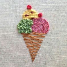 an ice cream cone with three different colored cones on it's top and bottom