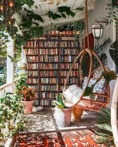 a room filled with lots of books and plants