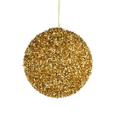 a gold ornament hanging from a chain