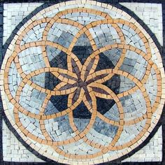 a circular design made out of small tiles