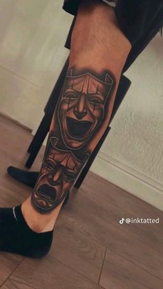 a man's leg with a tattoo on it that has an image of a clown