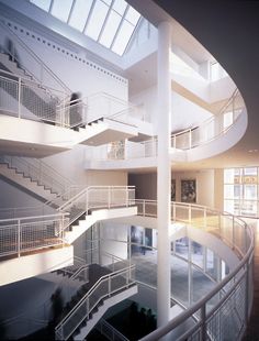 the inside of a building with multiple floors and balconies