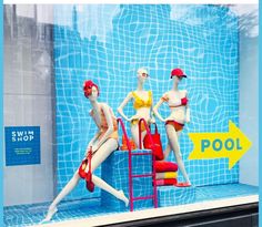 three mannequins dressed in bathing suits and hats are displayed behind a pool sign