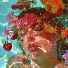 a woman with flowers in her hair and cherries on her head is surrounded by water