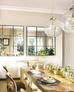 an instagram photo of a dining room table with plates and place settings on it