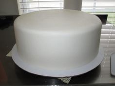 a white cake sitting on top of a counter