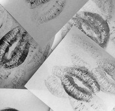 four pictures of different lips on white paper with black and grey inking in them