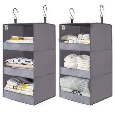 two gray storage bins with clothes on them