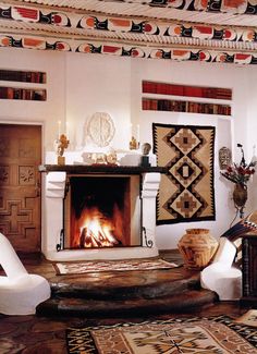 a living room filled with furniture and a fire place