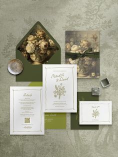 an assortment of wedding stationery items including cards, envelopes and stampers are displayed