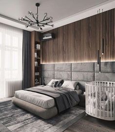 a bedroom with a large bed and a baby crib in the middle of it